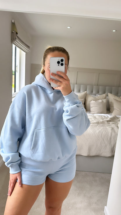 Powder blue oversized hoodie & shorts set airport outfit