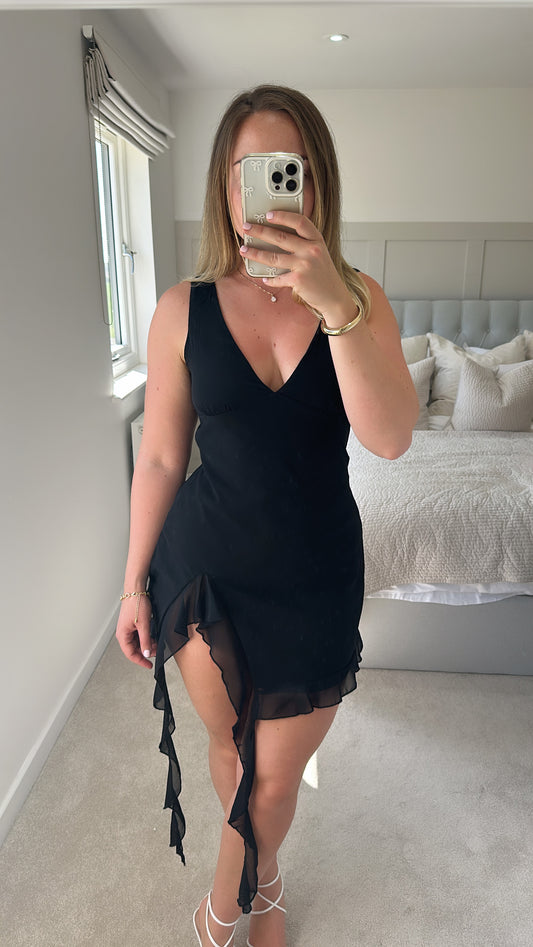 Black slit ruffle mini dress